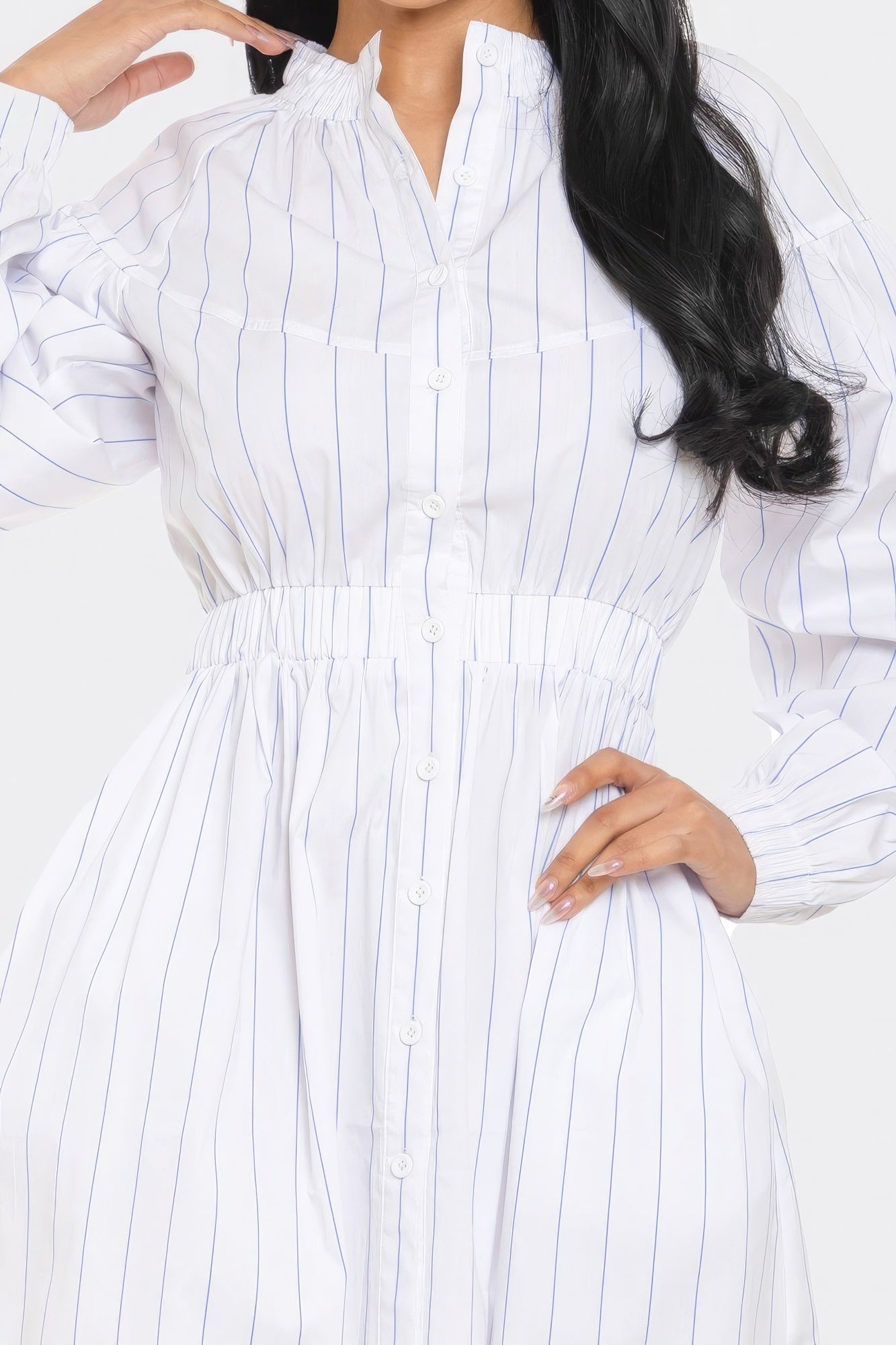 Striped mini dress with basic collar, dropped long sleeves, playful dolphin hem in classic white and blue, fit and flare silhouette.