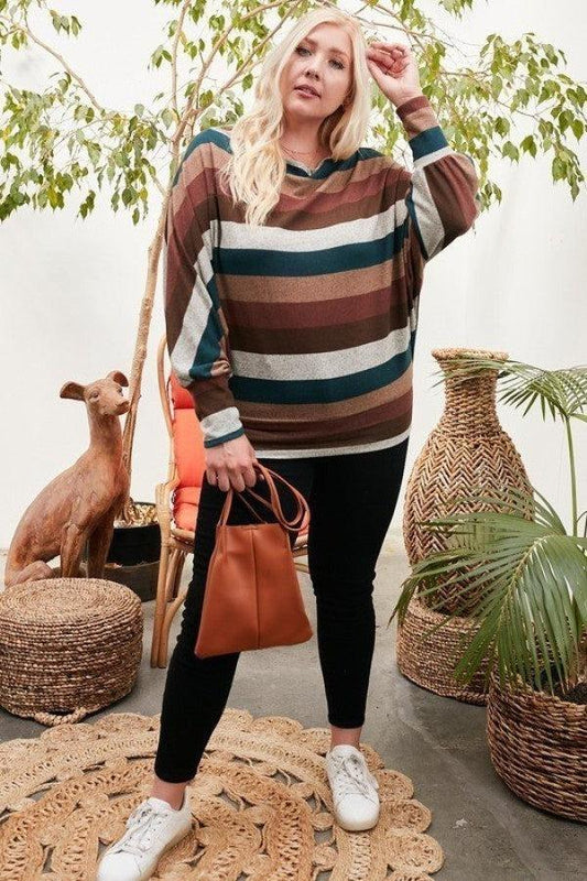 Woman wearing a long bubble sleeve multi-stripe knit top with boat neck in hunter green, styled with black pants and white sneakers.