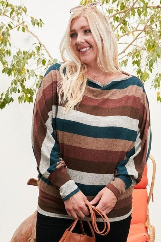 Woman wearing a boat neck multi-stripe knit top with long bubble sleeves in hunter green and multi colors, holding a brown handbag.