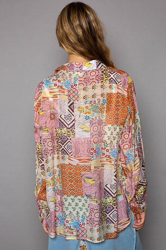 Woman wearing a colorful patchwork printed button-down long sleeve shirt with a relaxed fit, showcasing the back view.