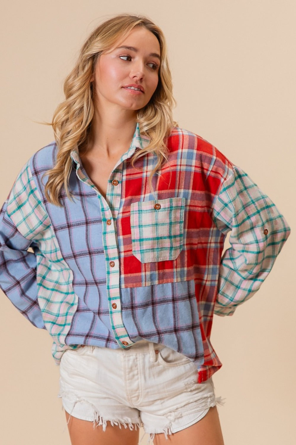 Woman wearing color block plaid button down shirt in blue and red with white shorts, 100% cotton, slightly stretchy fabric.