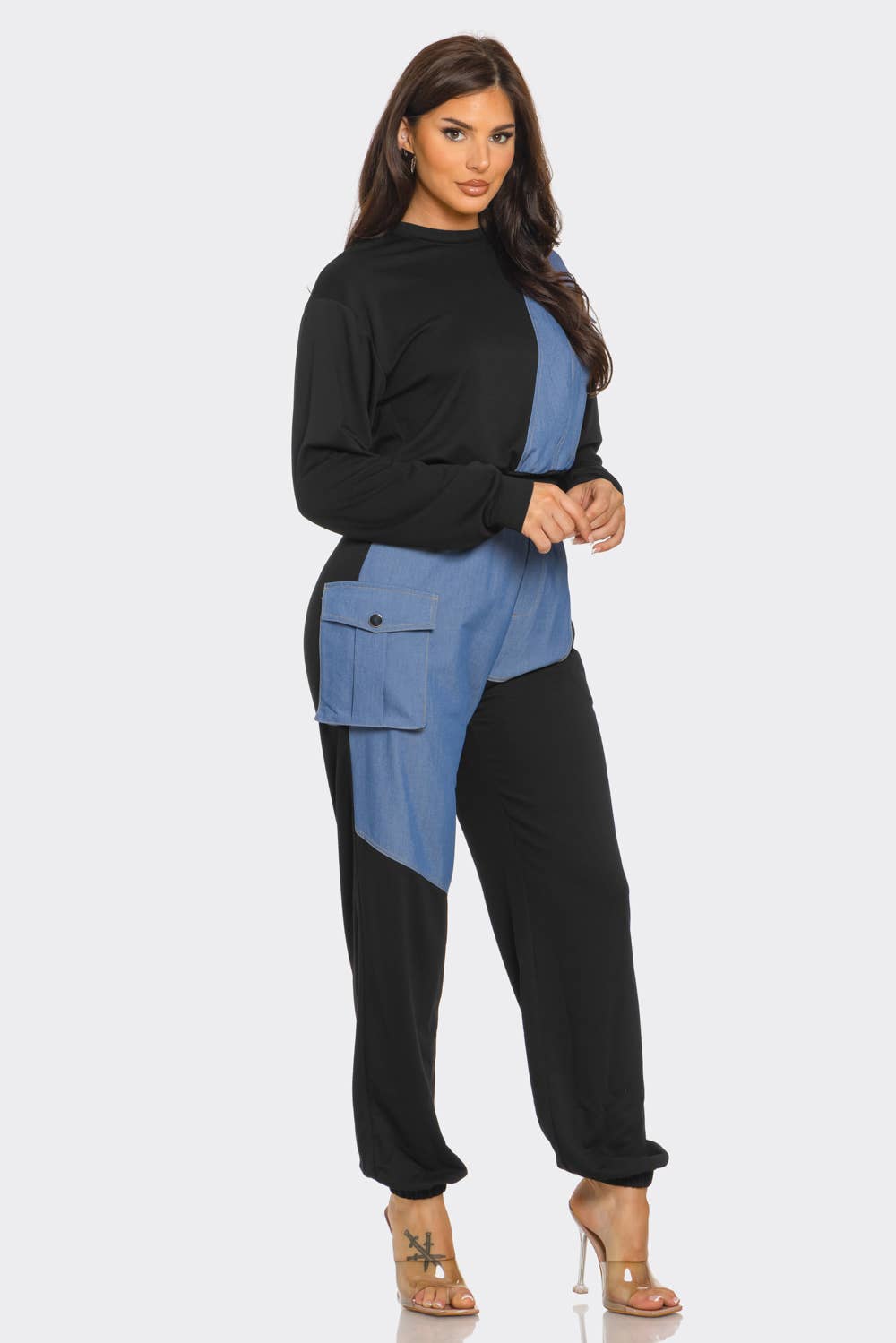 Woman wearing French Terry color block denim detail top and pants set with side pockets and elastic waistband.