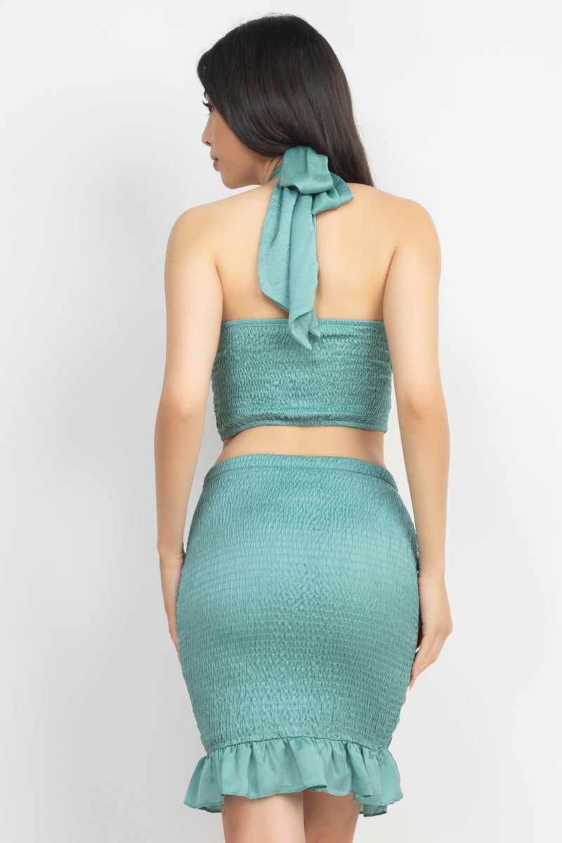 Sage halter neck crop top and skirt set with shirred detail and ruffled hem in polyester, viewed from the back.