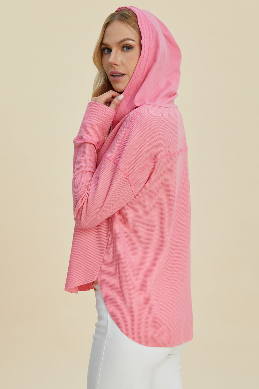 Pink high-low dropped shoulder long sleeve hoodie, slightly stretchy, 65% polyester, 35% cotton.