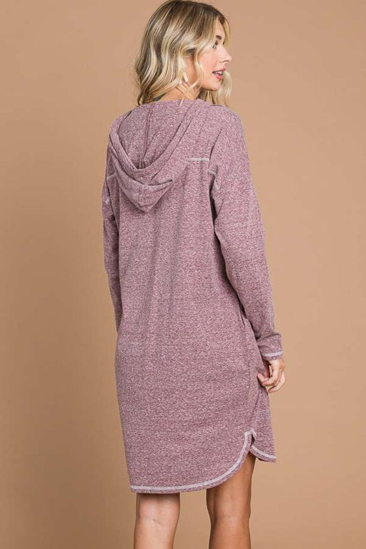 Woman wearing a hooded long sleeve sweater dress in mauve, featuring a basic style with moderate stretch for comfort.