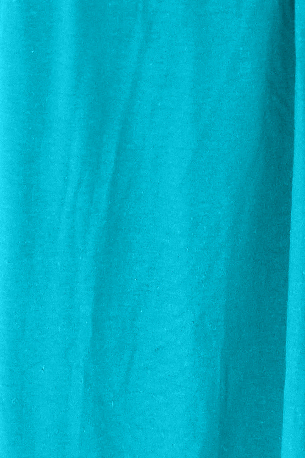 Close-up of turquoise fabric texture with a slightly stretchy and opaque appearance, made of rayon and spandex blend.