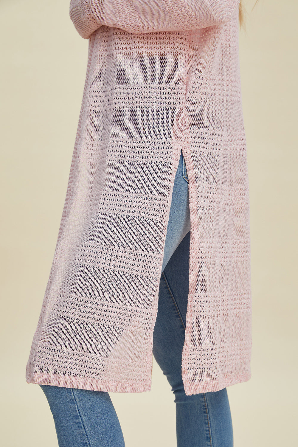 Pink open front longline cardigan with openwork design, shown from the side, featuring a moderate stretch, made of 100% polyester