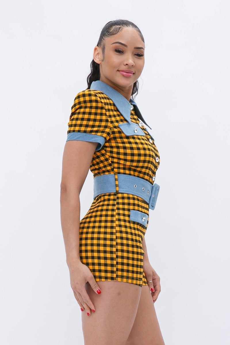 Yellow plaid print denim romper with wide belt and button-up closure, featuring high stretch for a comfortable fit.