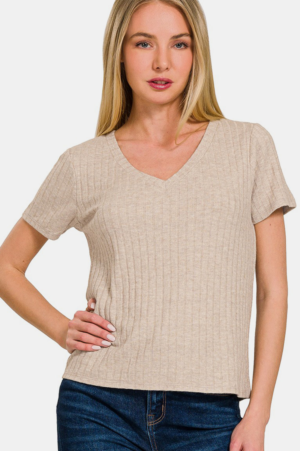 Beige ribbed short sleeve t-shirt, V-neck, made of 50% rayon, 28% polyester, 22% nylon, styled with blue jeans.