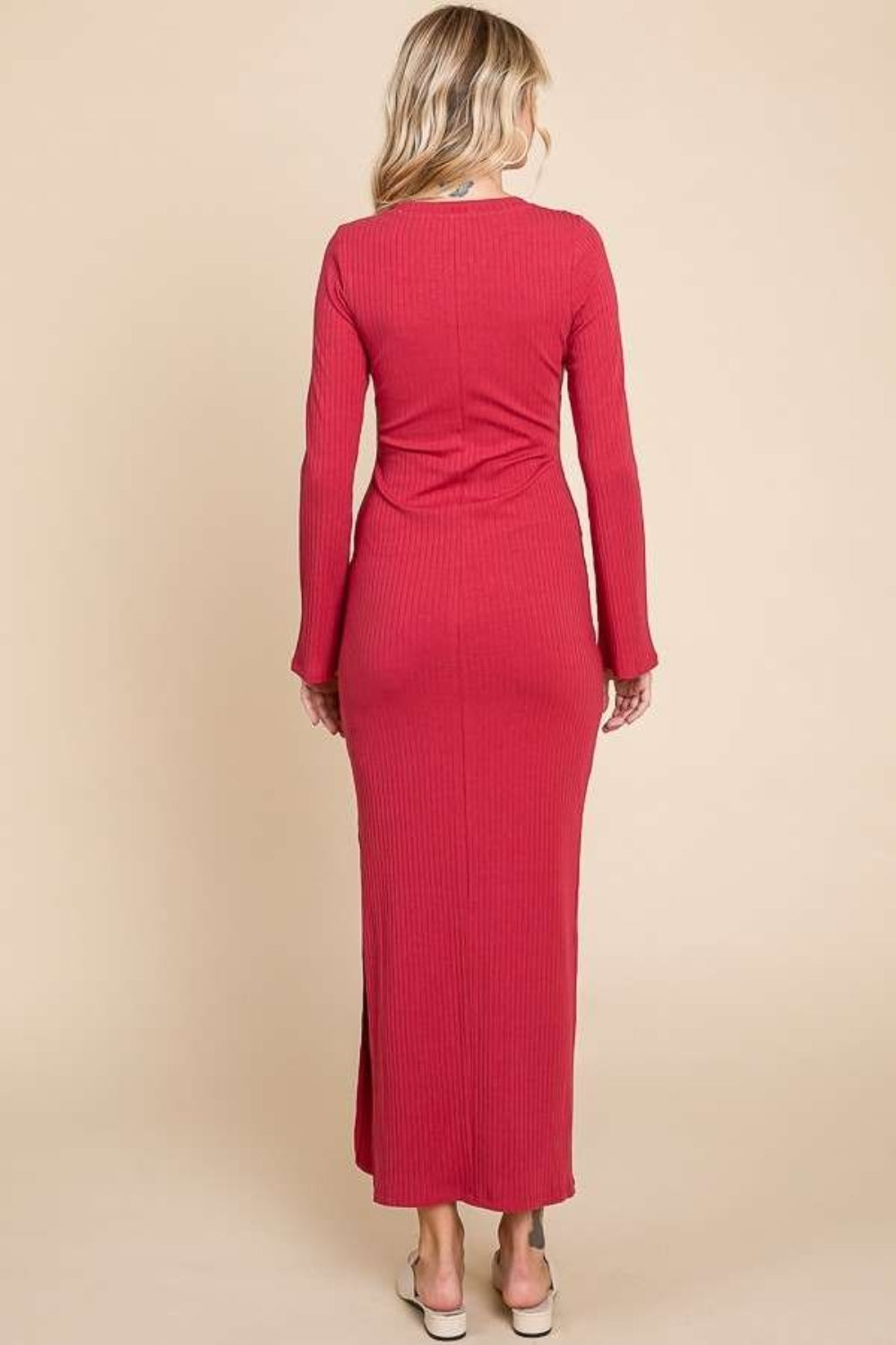 Red round neck bodycon bell maxi dress with full sleeves, made of stretchy cotton-rayon-spandex blend, viewed from the back.