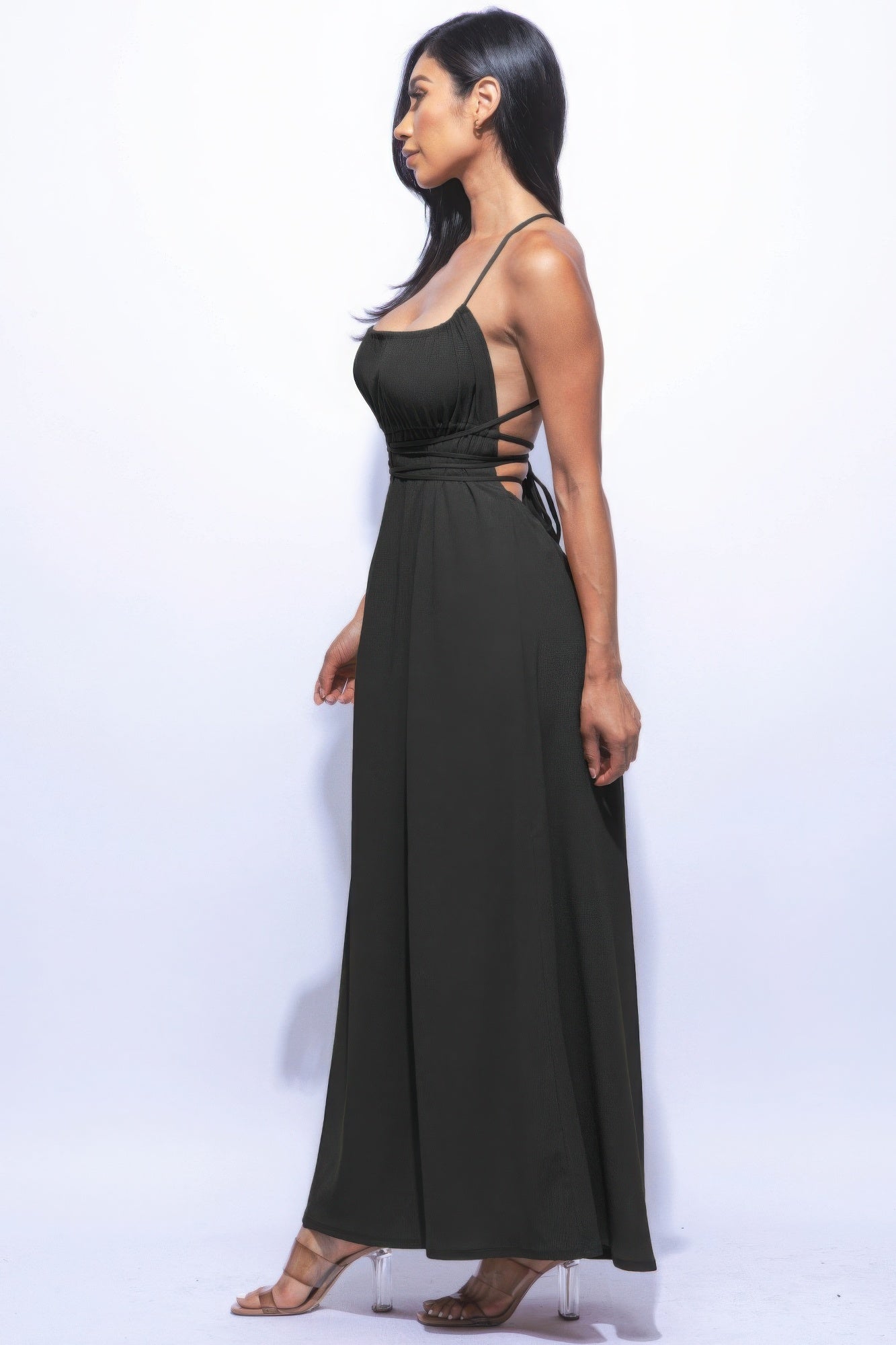 "Side Slit Maxi Skirt in black with strappy tie back, featuring elegant slit and flare silhouette, perfect for versatile styling"