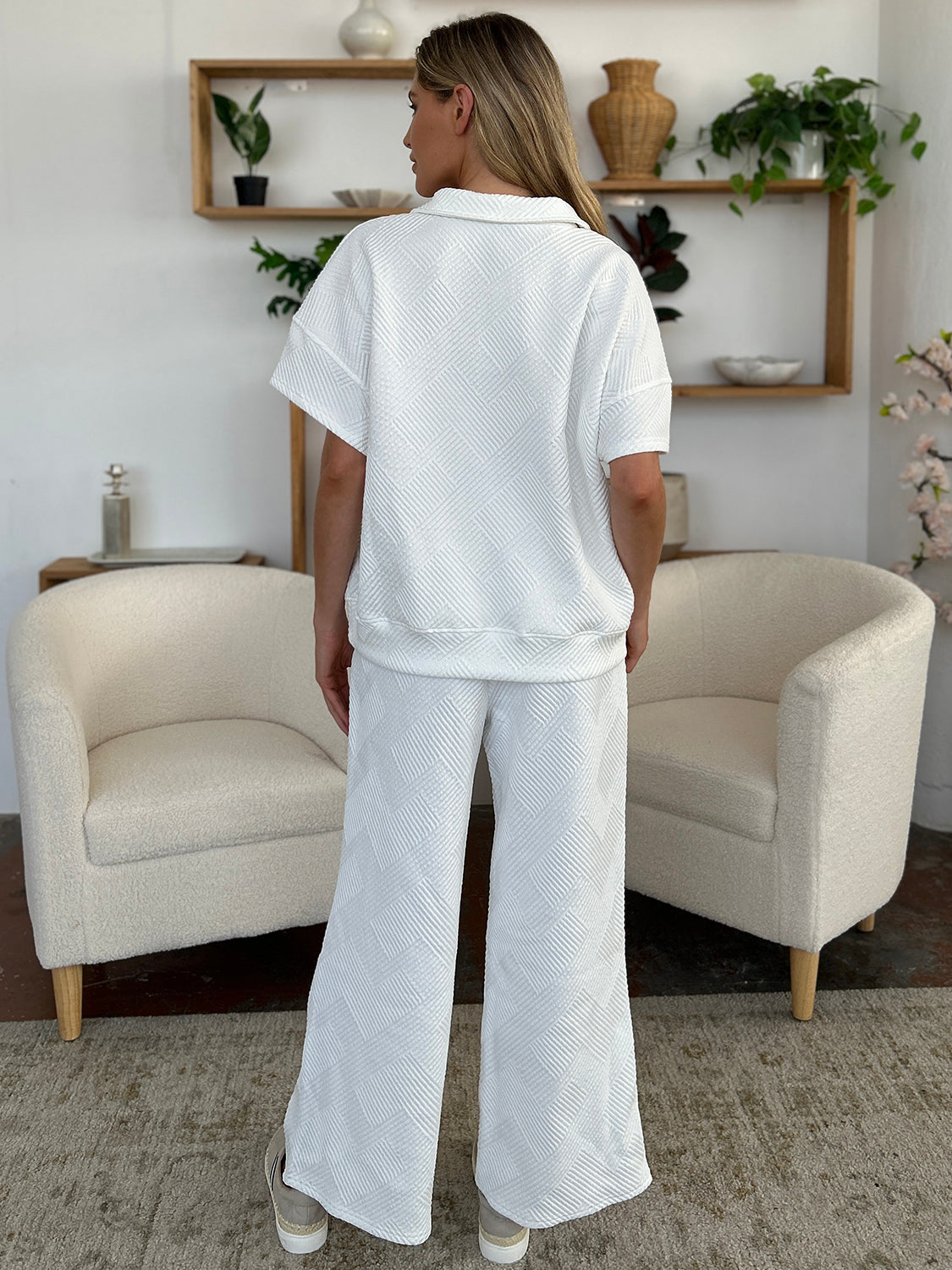 Woman wearing Texture Half Zip Short Sleeve Top and Pants Set, pocketed with drawstring, slightly stretchy in polyester blend.