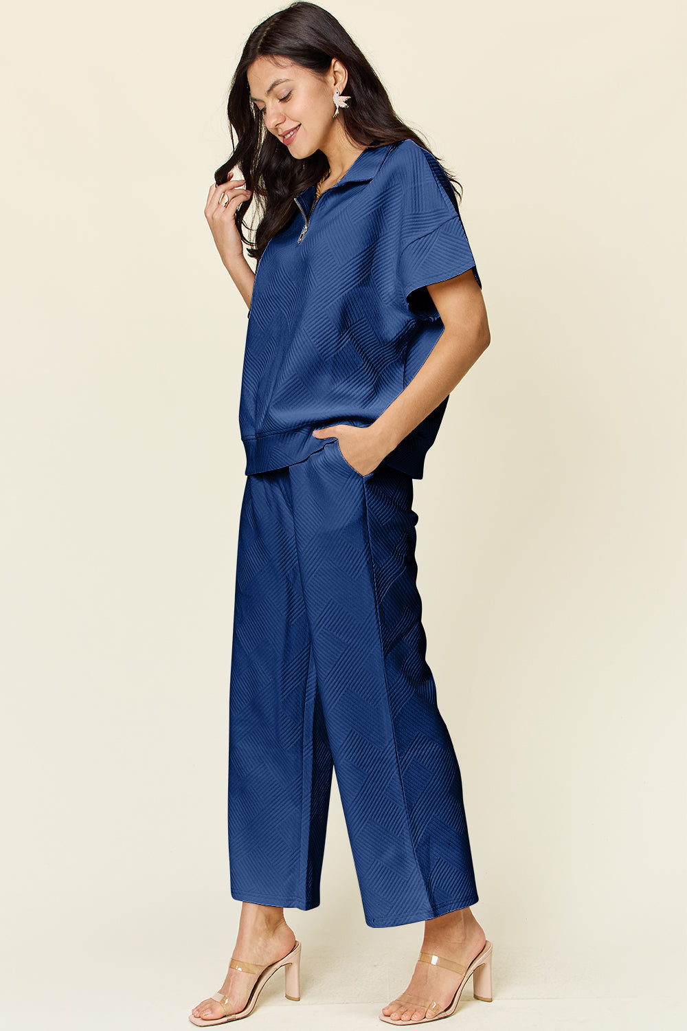 Stylish full-size blue texture half zip short sleeve top and pants set with pockets and drawstring, slightly stretchy fabric.