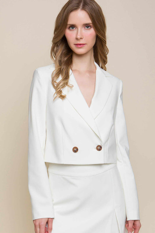 White button crop blazer crafted from 95% polyester and 5% spandex, featuring a stylish and modern design for versatile wear.