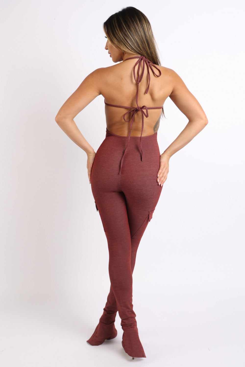 Stylish brick cargo pocket halter jumpsuit in S.M.L sizes, made of rayon, polyester, and spandex blend, showcasing a back view.