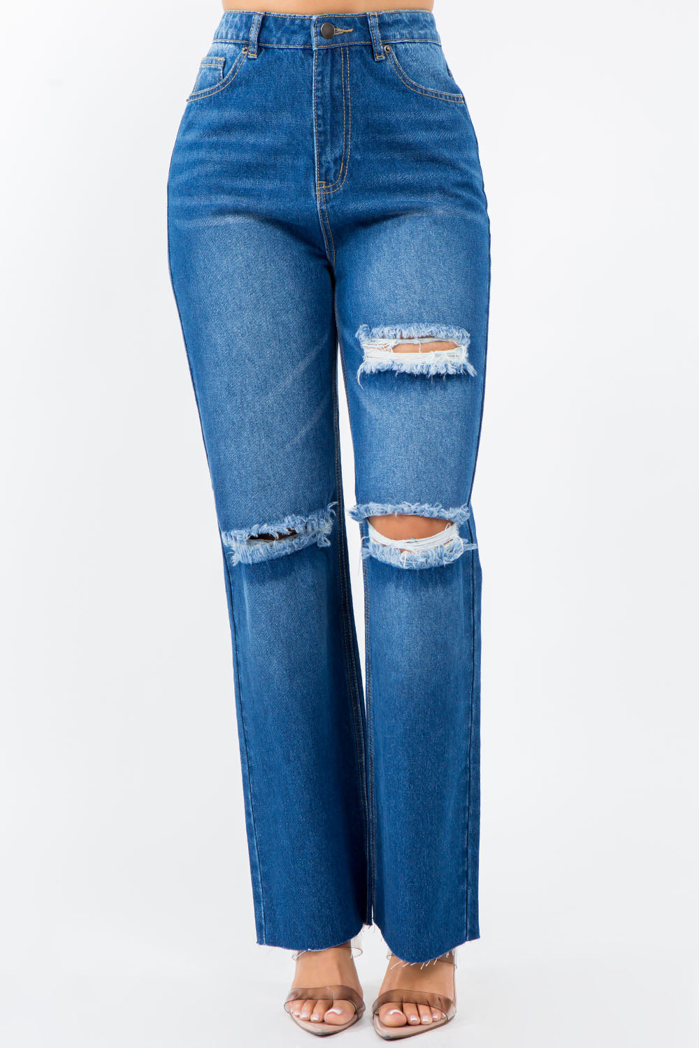 High-waist distressed wide leg jeans with raw hem and pockets, made from stretchy cotton denim, ideal for versatile fashion looks.