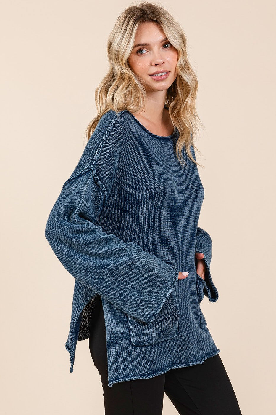 Woman wearing Mittoshop Mineral Wash Patch Pocket Cut Edge Sweater with exposed seam and relaxed fit.