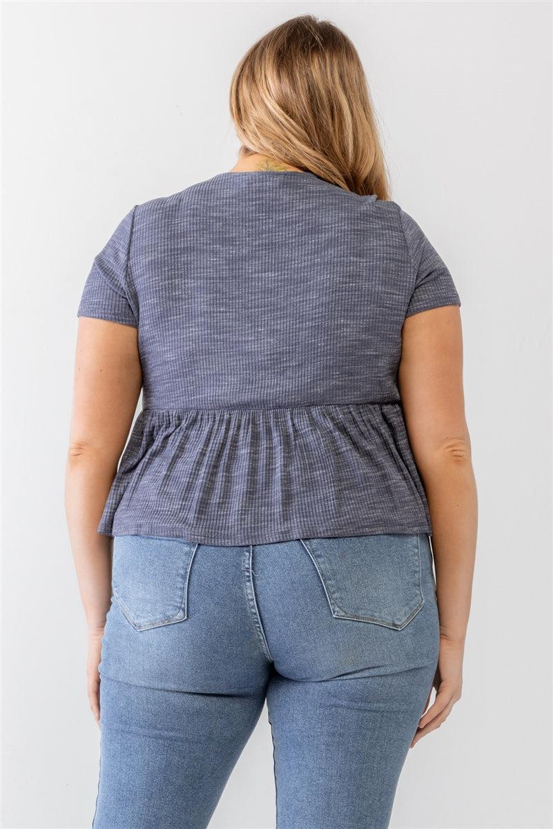 Plus size denim blue blouse with ribbed short sleeves and flare hem, rear view, semi-stretchy fabric, stylish modern clothing.