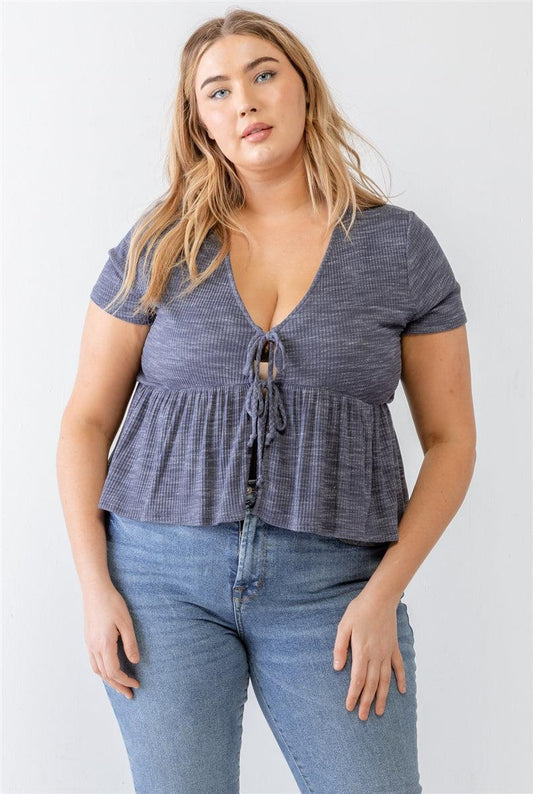 Plus size denim blue blouse with ribbed sleeves, U-neckline, and flare hem tie details - trendy and stylish for modern wear.