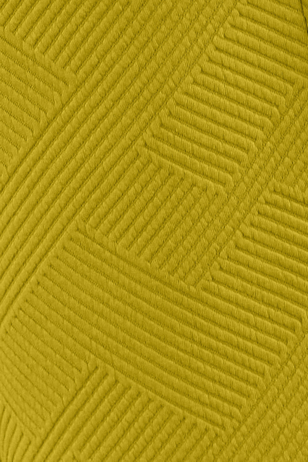 Textured fabric close-up in mustard yellow with geometric pattern