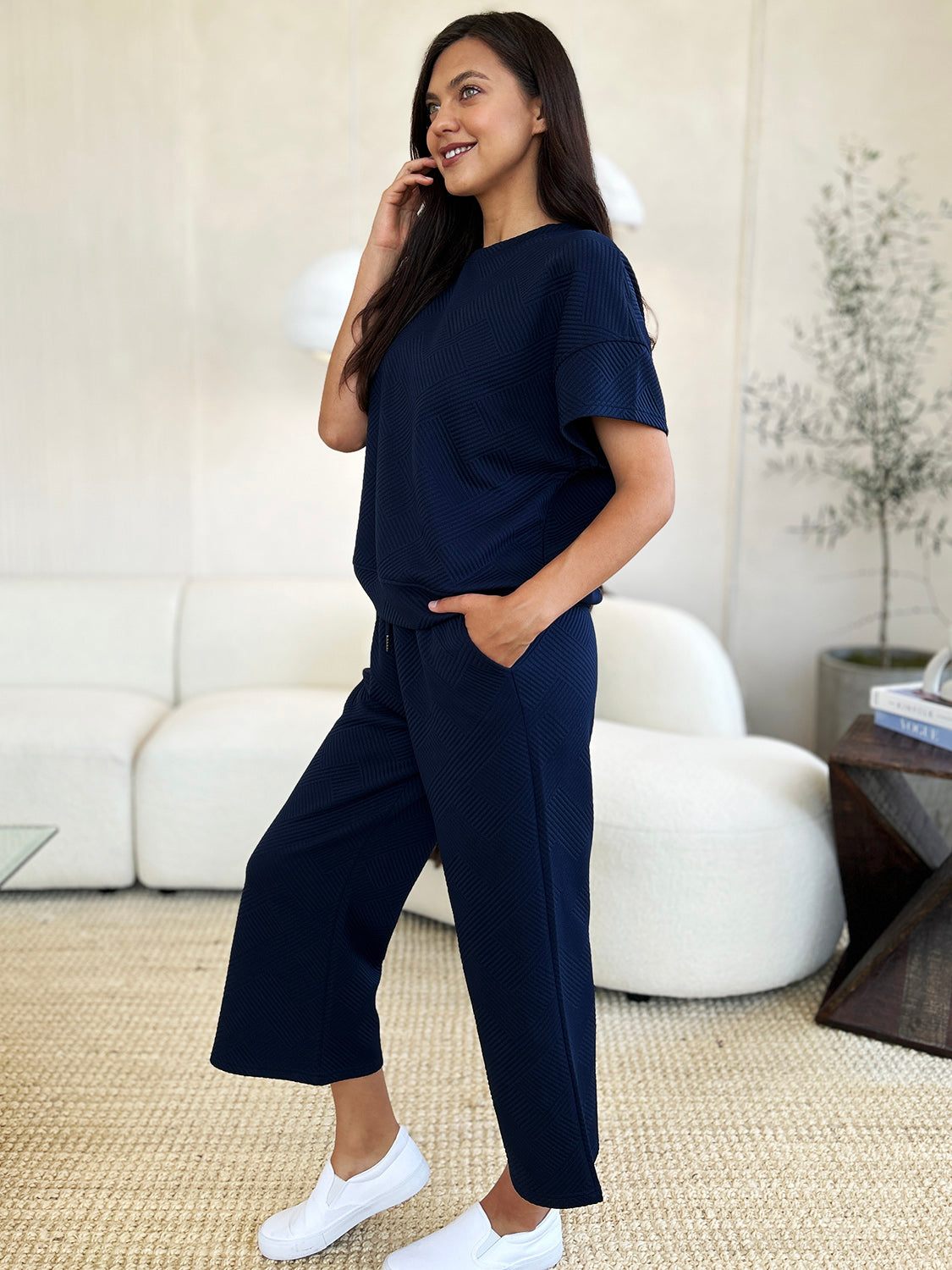 Woman wearing navy Texture Short Sleeve Top and Pants Set with drawstring, slightly stretchy, made of 95% polyester and 5% spandex.