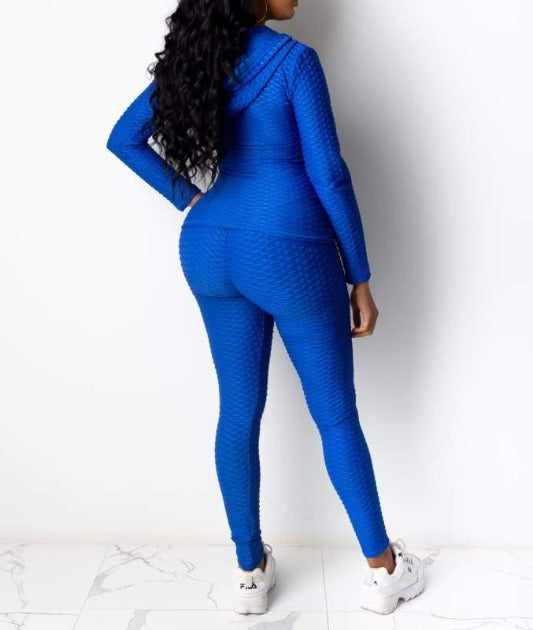Woman modeling Baddie With Body Brazil Two-Piece Set in blue, made from polyester and spandex, featuring a textured design.