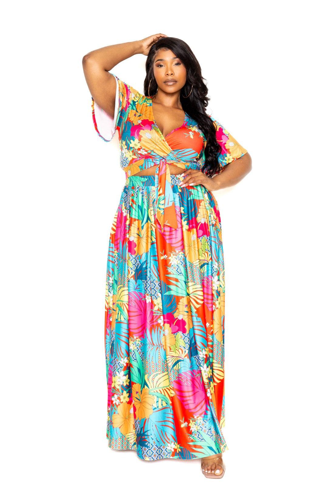 Plus size tropical floral maxi skirt and top set with vibrant colors and short sleeves, made of polyester and spandex.