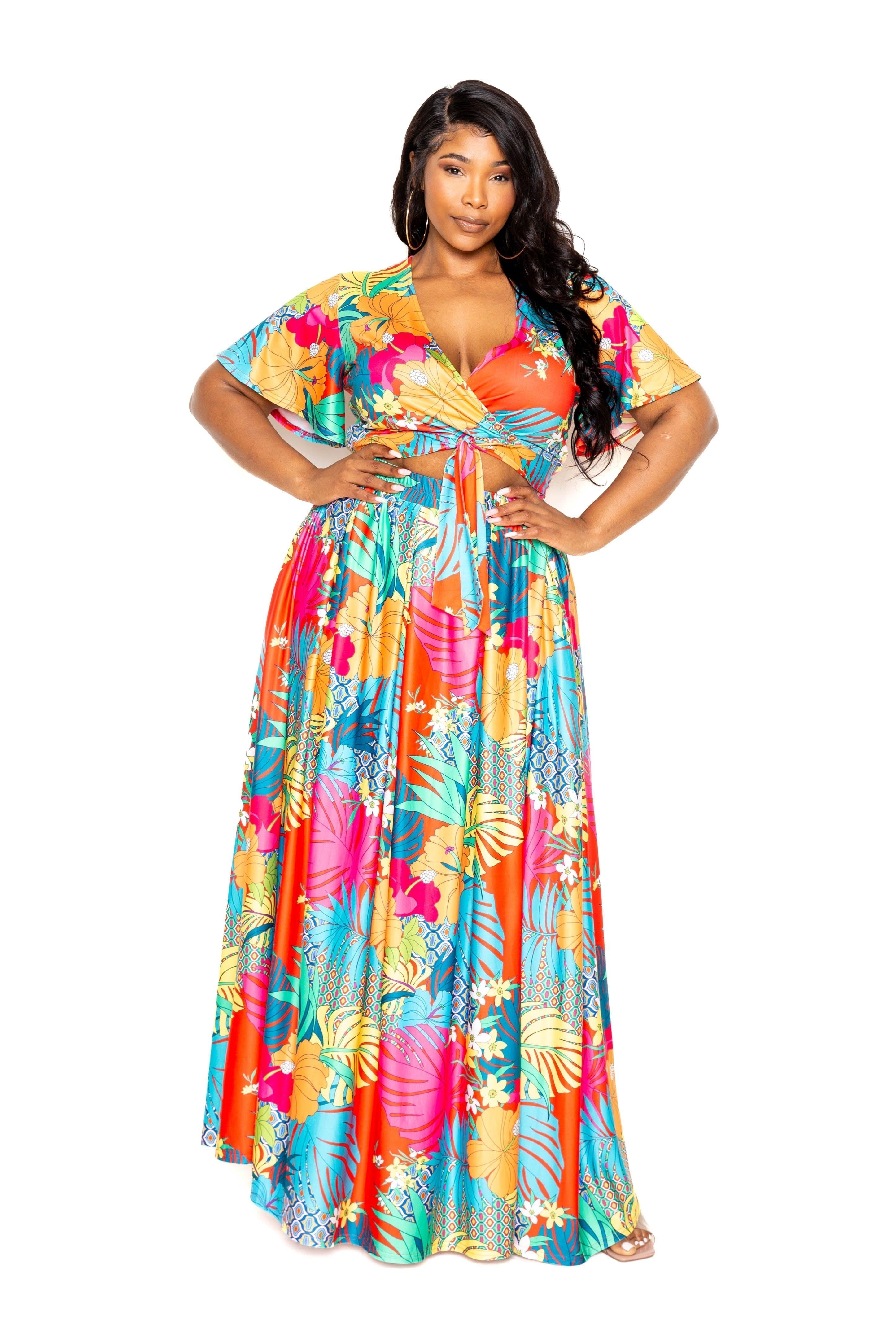 Tropical floral plus size maxi skirt and top set in vibrant colors, featuring short sleeves and a tie-front design.