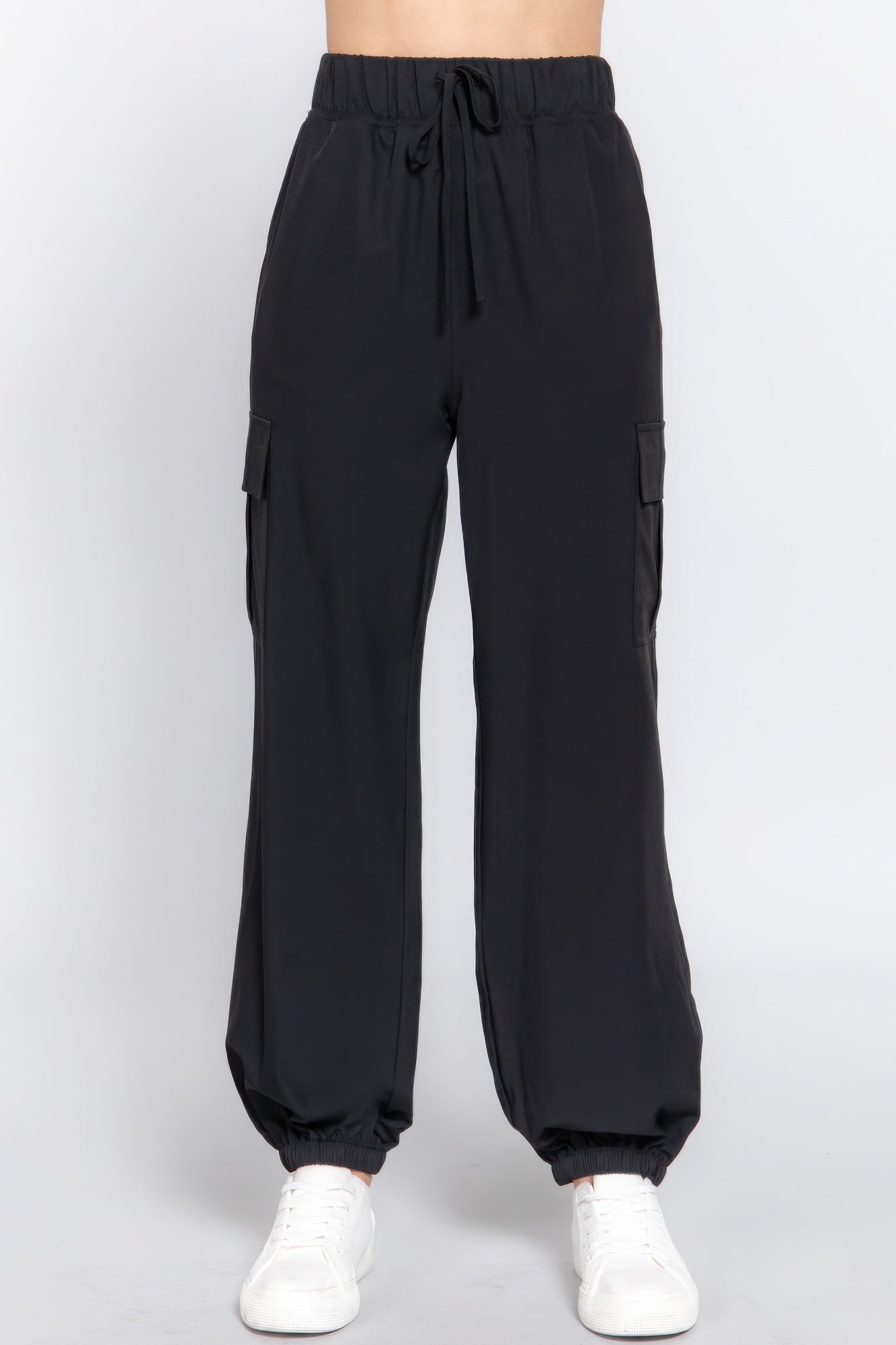 Black lightweight stretch woven cargo jogger pants with trendy pockets, perfect for casual wear.