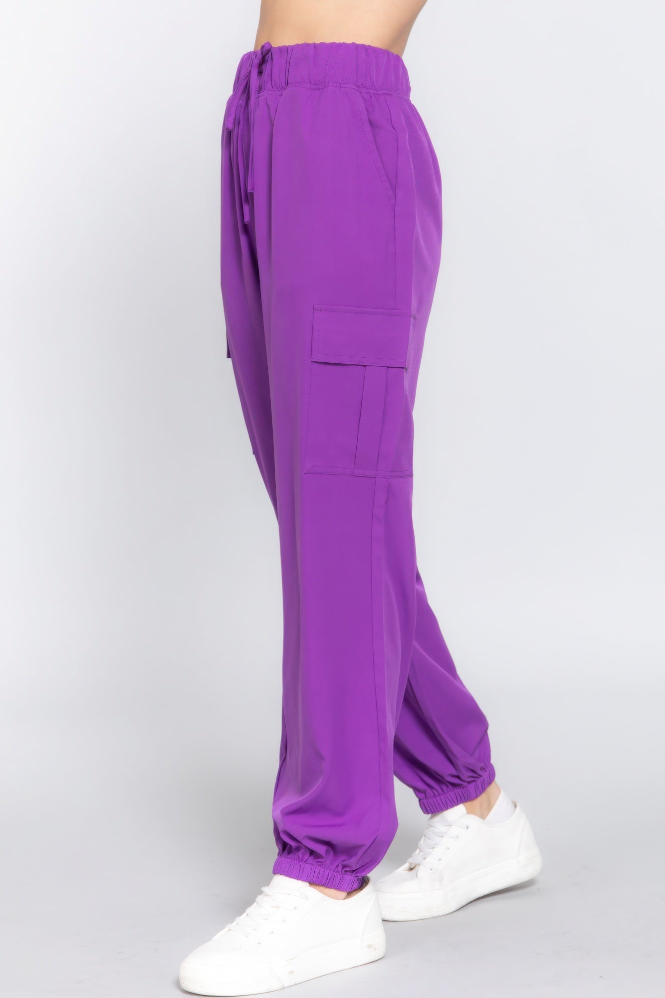 Stylish purple cargo jogger pants with trendy pockets, lightweight stretch fabric, perfect for casual wear and comfort.