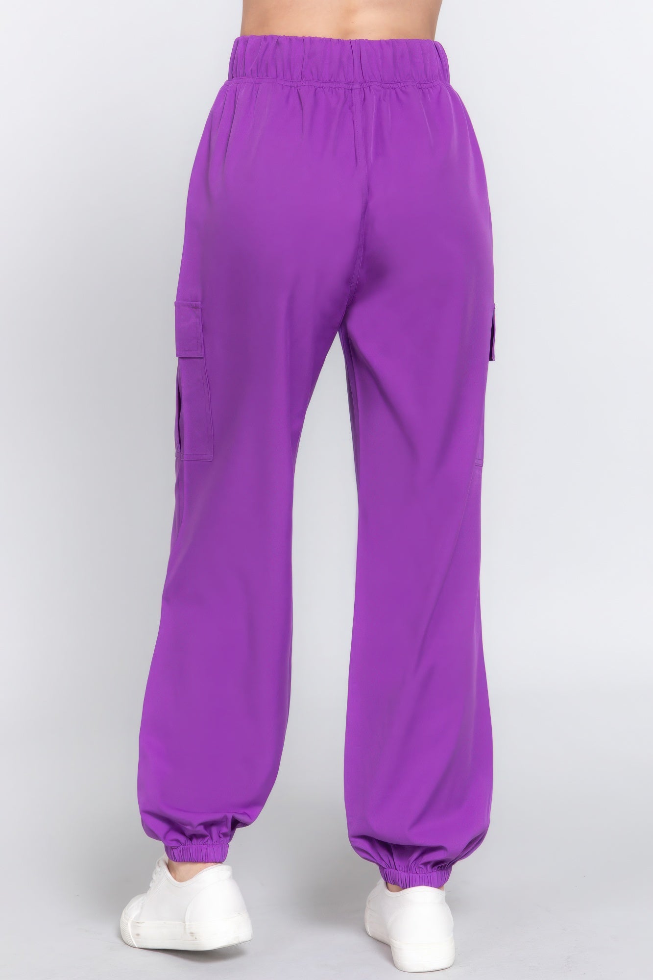 Purple lightweight stretch woven cargo jogger pants with pockets, showcasing a modern silhouette for casual wear.