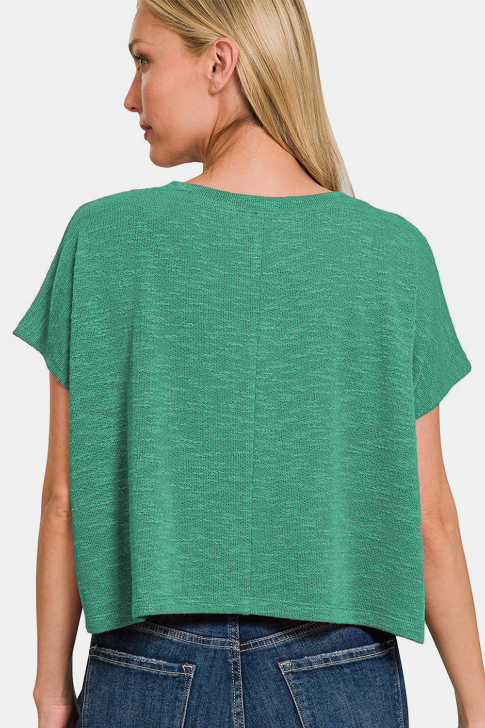 Green V-neck short sleeve T-shirt with no stretch, made from polyester, rayon, and spandex, shown from the back on a person.