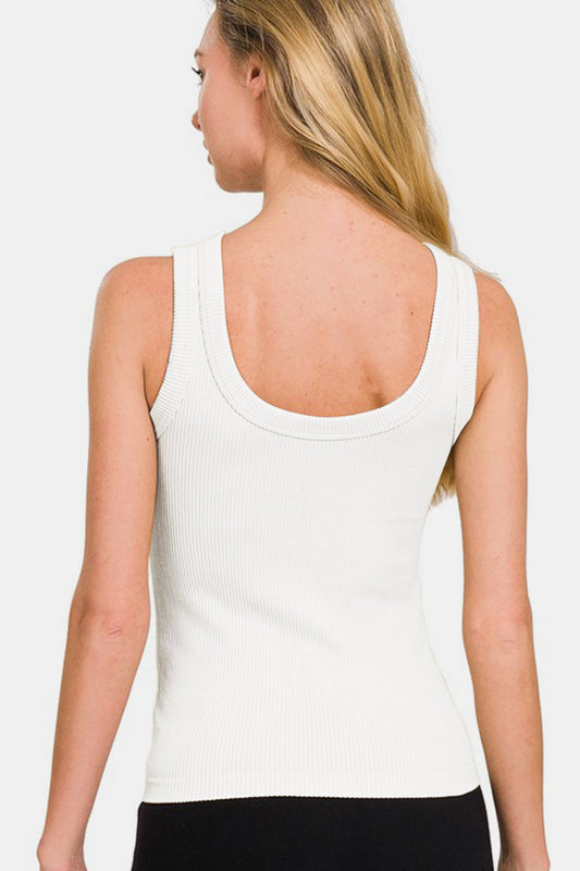 Woman wearing a white 2-way neckline ribbed tank top with moderate stretch and opaque fabric made of 90% nylon, 10% spandex.