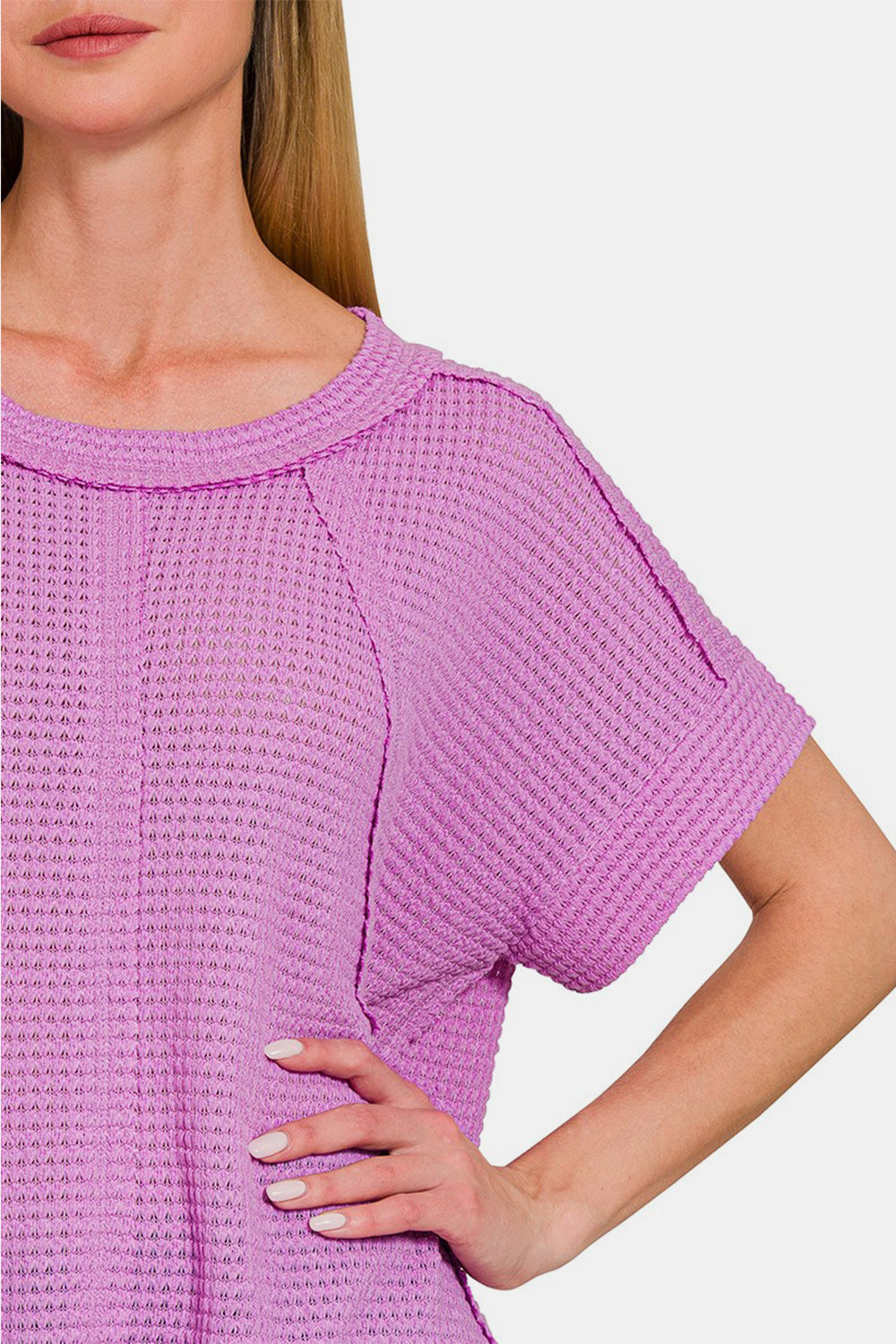 Lavender waffle-knit short sleeve t-shirt with exposed seams, featuring a relaxed fit and slight stretch.