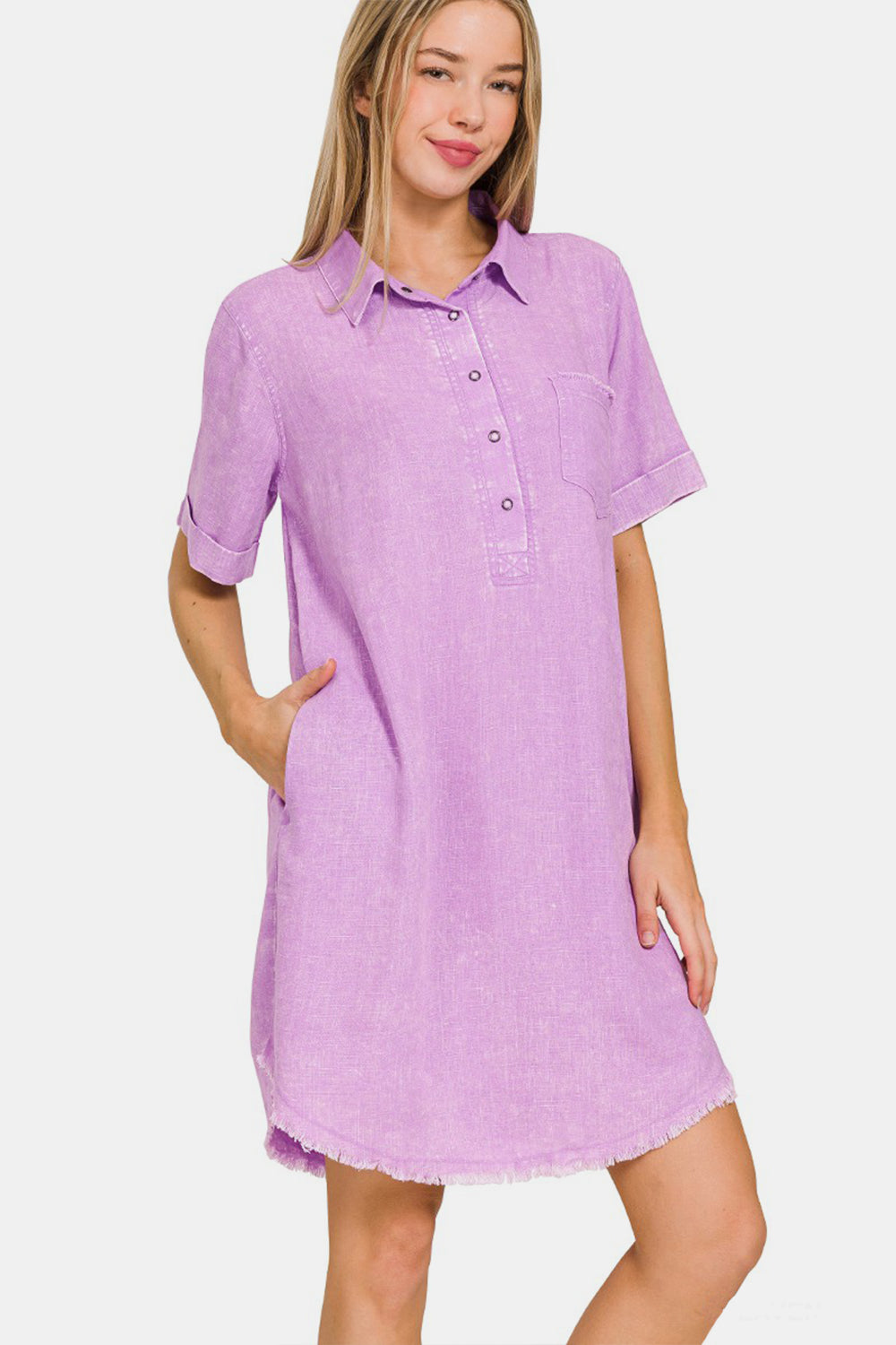 Lavender washed linen dress with raw hem, pockets, short sleeves, and moderate stretch, made of 25% linen and 75% rayon.