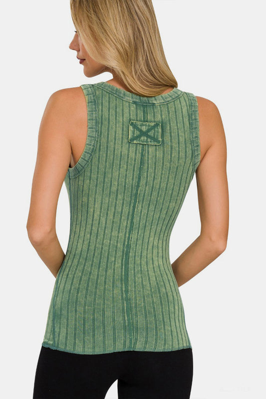 Woman wearing a green washed ribbed half snap Henry tank top made of rayon and spandex, showcasing moderate stretch and opaque fabric.