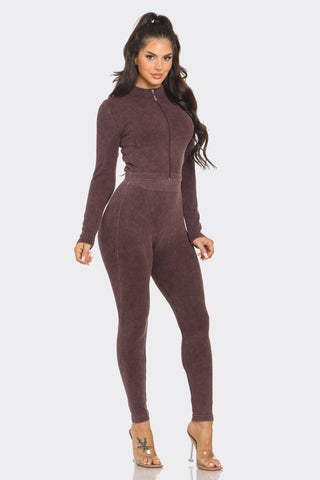 Woman wearing washed seamless rib zip-up jacket and leggings set in brown.