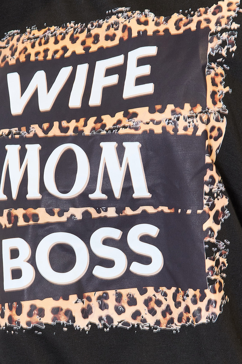 "Close-up of Wife Mom Boss leopard graphic on black T-shirt"