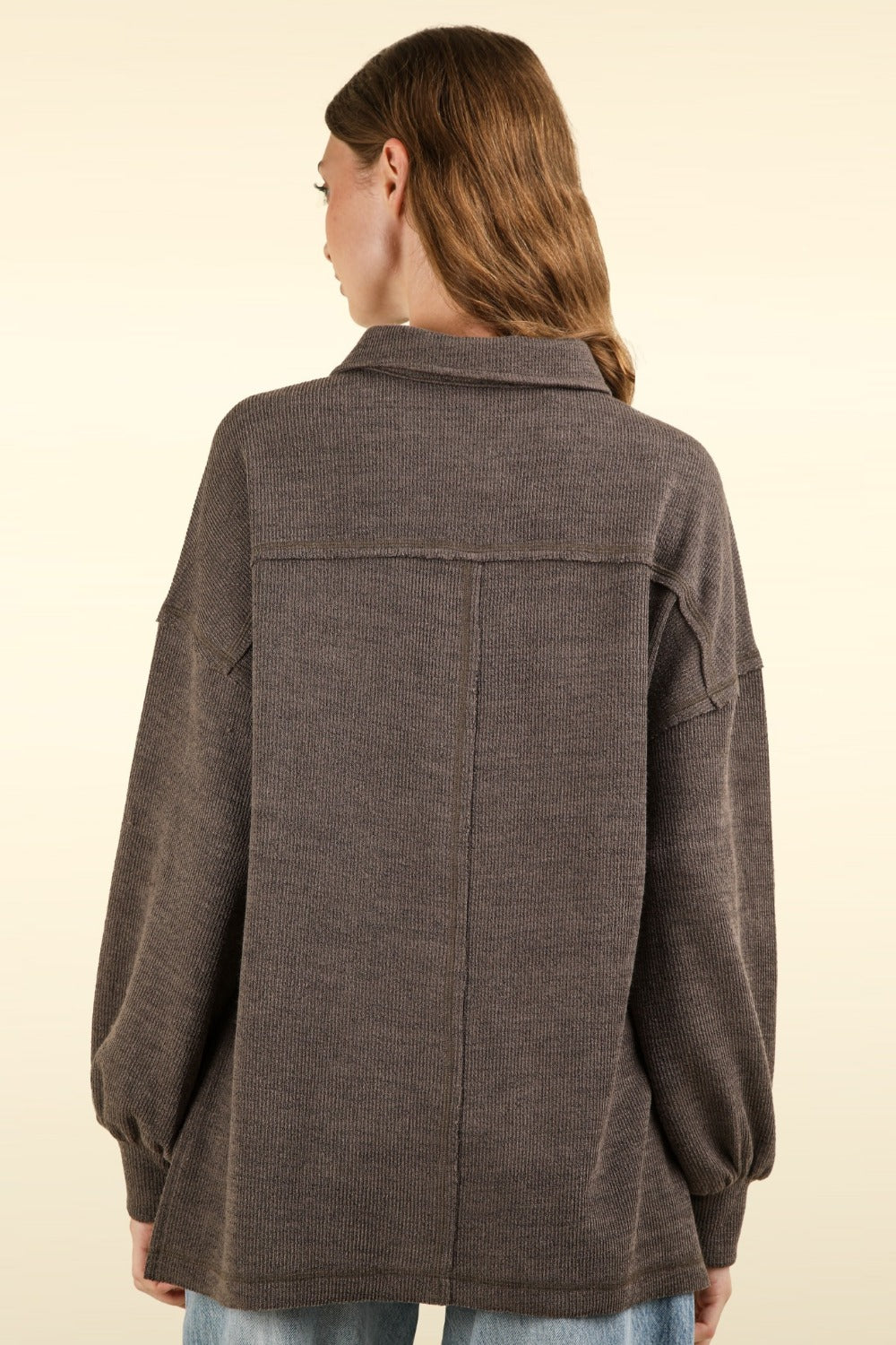 Women's charcoal knit top with a collar and drop shoulders, back view showing oversized fit and long sleeves.