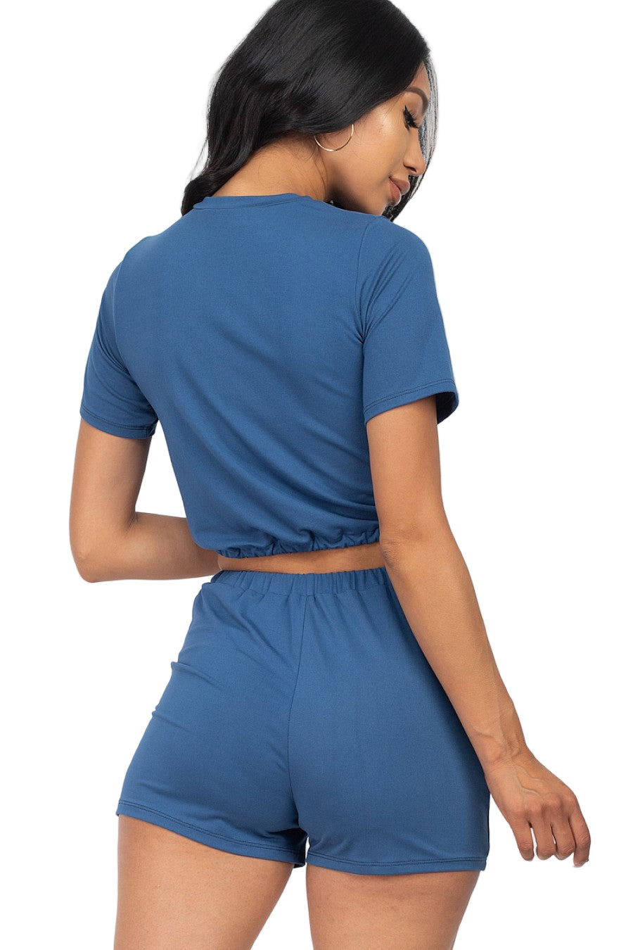 Woman wearing blue front tied crop top & shorts set made of soft Jersey fabric perfect for summer casual wear.
