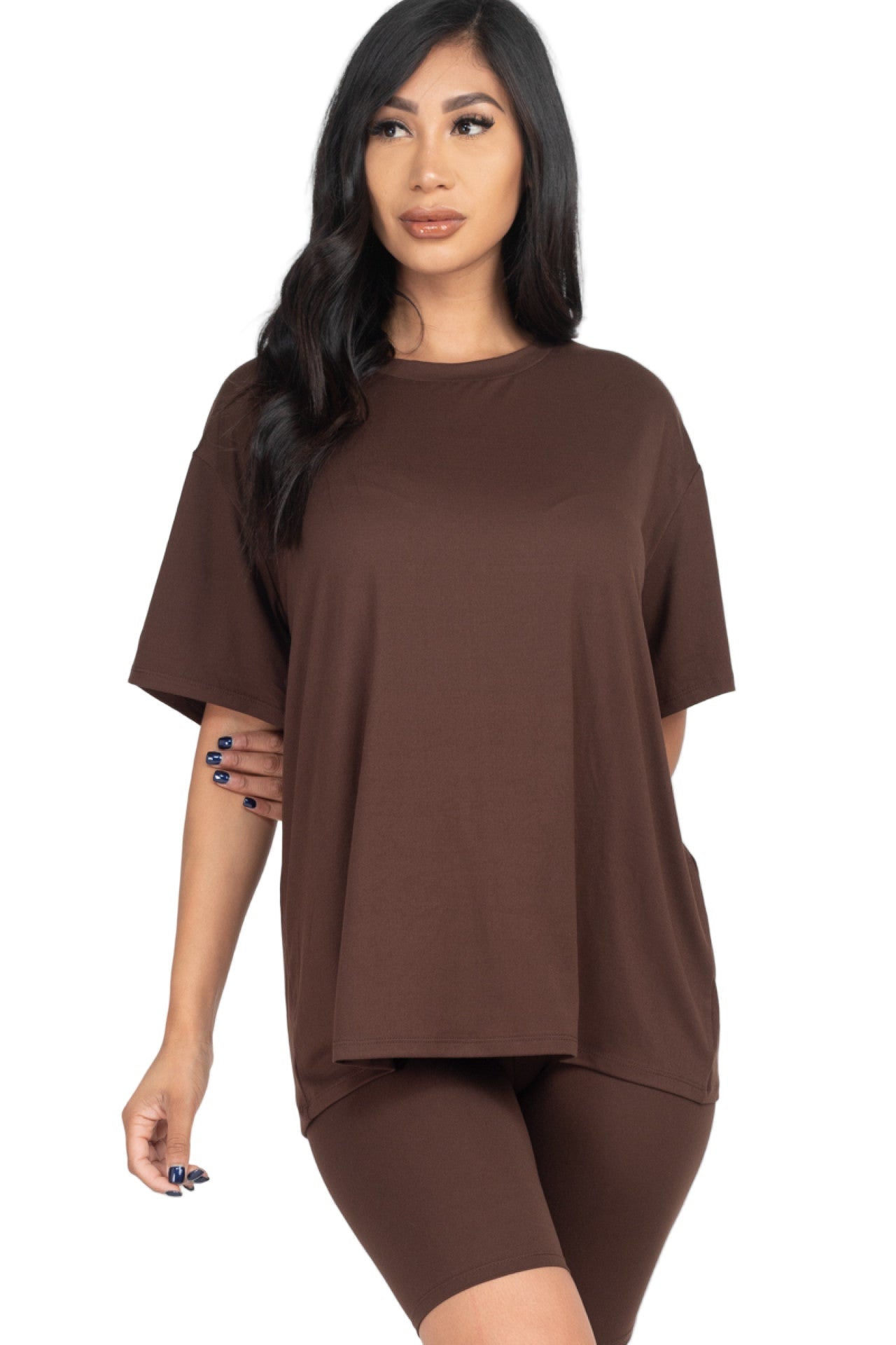 Woman wearing loose fit top and biker shorts set in brown, soft stretchy fabric, perfect for casual and workout, elasticized waist.
