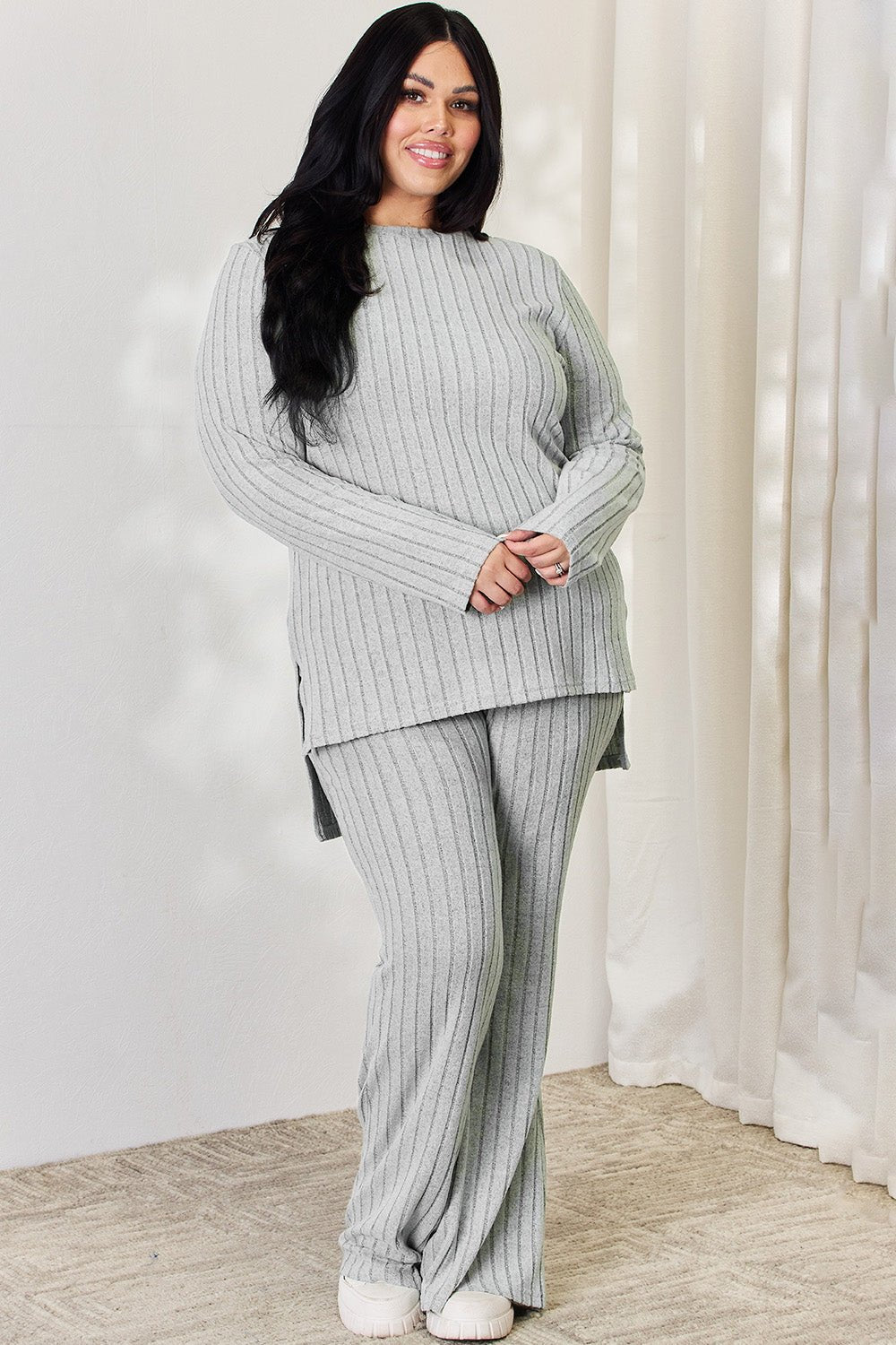 Ribbed high-low top and wide leg pants set in grey, plus size model, stylish and comfortable two-piece outfit for everyday wear.