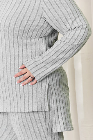 Ribbed high-low top and wide leg pants set in gray, highlighting knit texture and stylish side detail for a chic, comfortable look.