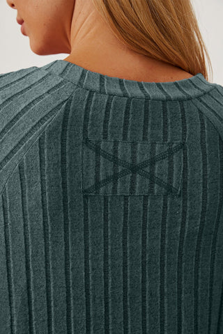 Close-up of ribbed fabric on Basic Bae t-shirt showcasing texture and stitching details.