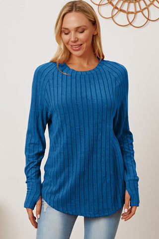 Woman wearing blue Basic Bae Ribbed Thumbhole Sleeve T-Shirt with a casual style, showcasing a comfortable fit and slightly stretchy material.