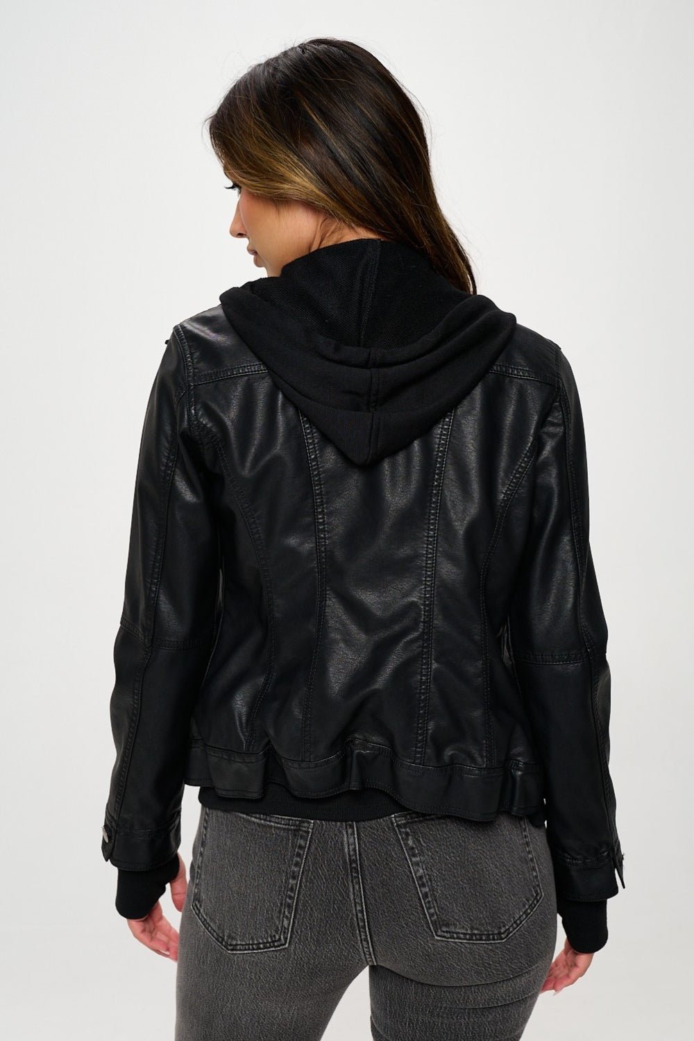 Woman wearing Coalition LA Double Zip Hooded Long Sleeve Jacket, showcasing the stylish back view in sleek black material.